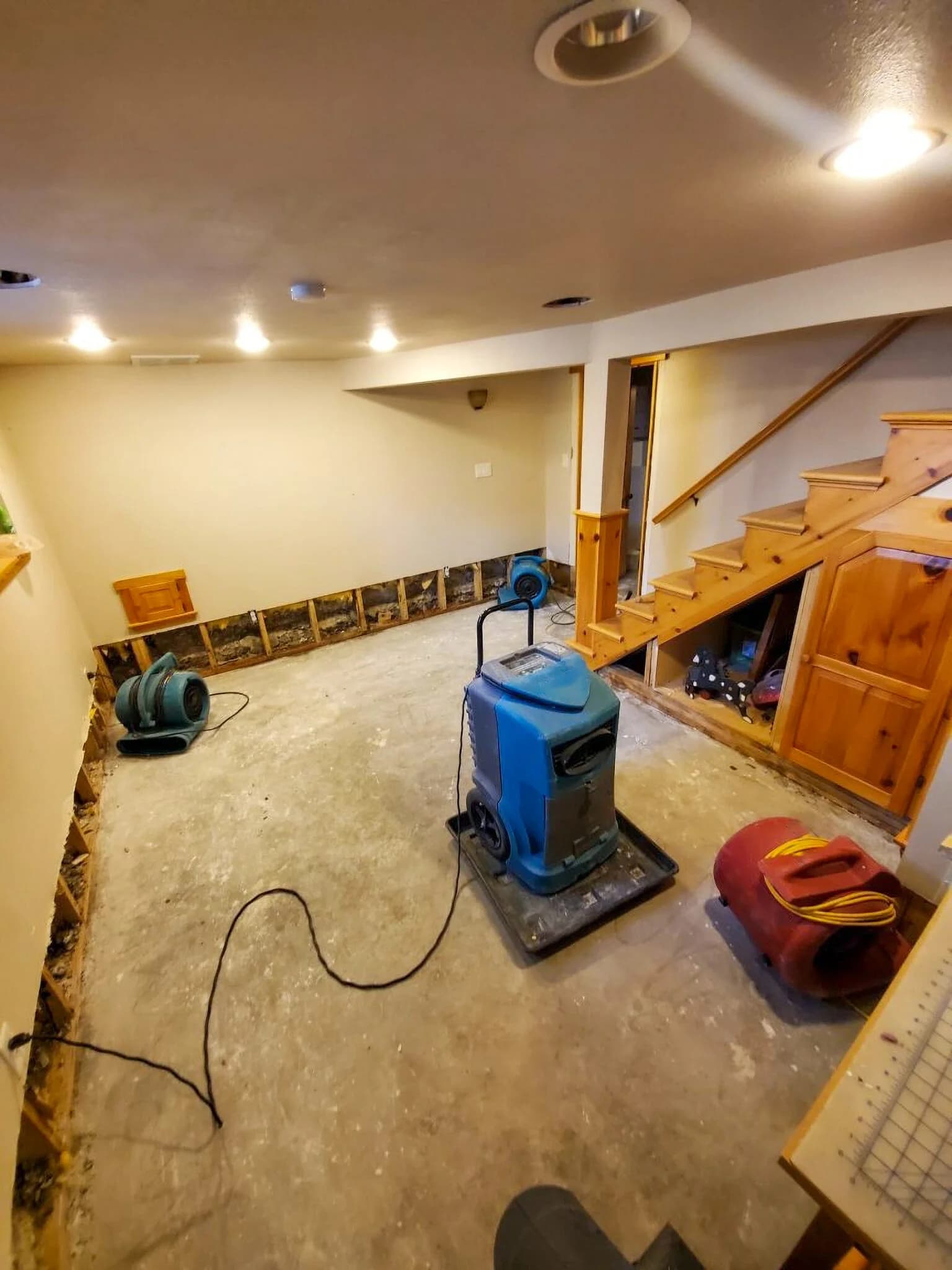 Professional drying equipment inside a water-damaged property